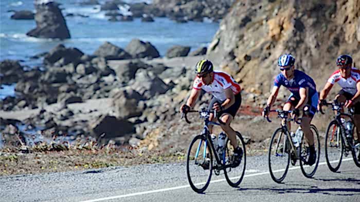 Cyclist On Coastal Bike Path With A Buddy Preparing For A Century Ride