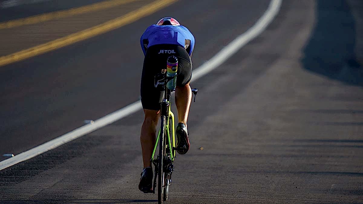A Male Cyclist Rides His Tt Bike On A Road Near Kona, Hawaii.