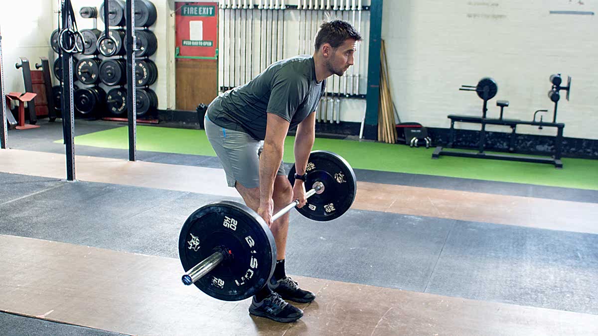 Image Of A Runner Deadlifting To Experience Deadlift For Runner Benefits