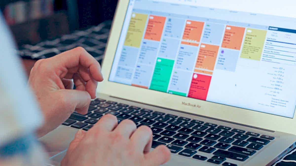 20067 Blog 1200×675 An Athlete Working On A Laptop Looking At Their Trainingpeaks Calendar In The App