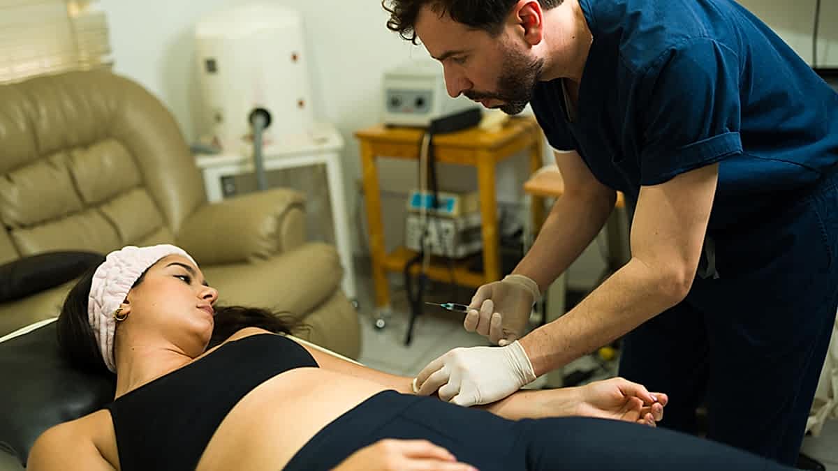 Athlete Patient Receiving Regenerative Prp Treatment From Physical Therapists